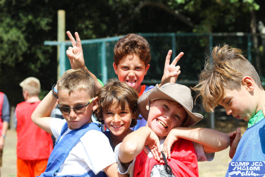 group of boys making silly faces and posing for the camera.